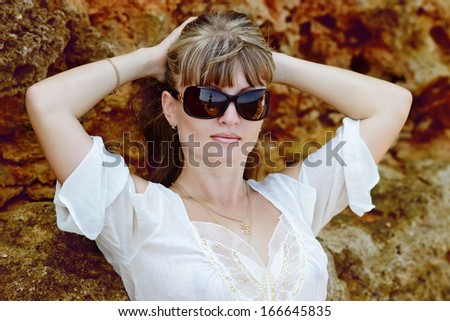 relaxing  woman near the rock