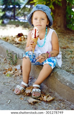 happy child with huge  ice cream cone