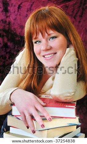 clever and beautiful redheaded girl is going to pass an exam, so she has to read a lot of books