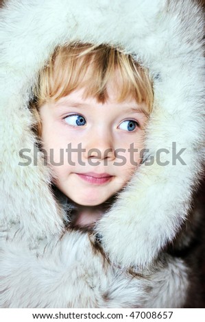 little lovely  girl wearing fur hat