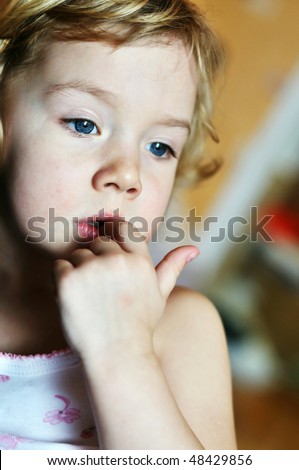 stock photo : nail-biting - bad habit for children in soft focus