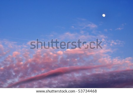 evening sky with plane and moon