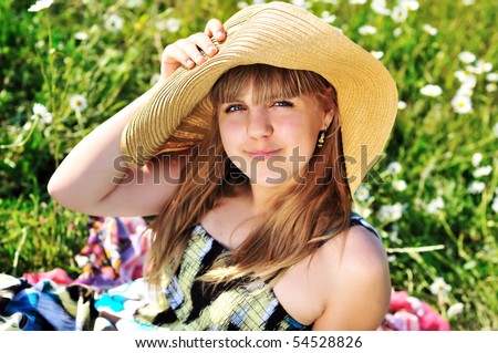 stock photo sweet teen girl laying on the daisy meadow
