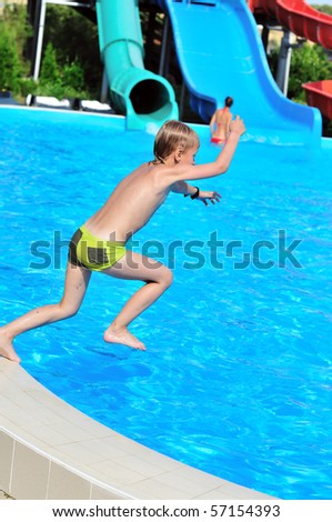 funny slim boy jumping to the pool