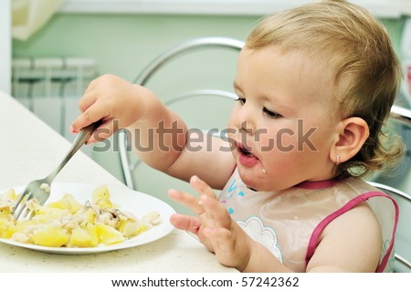 baby girl like eating with fork on her own