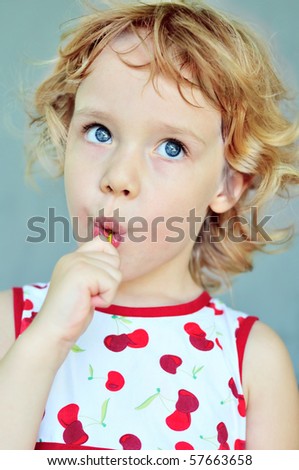 portrait of sweet girl with lollipop