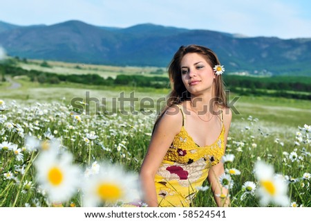 tender girl with daisy flower in hair