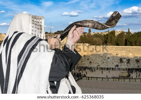 Man blowing Shofar horn for the Jewish New Year holiday (Rosh Hashanah)/Shofar at the Kotel/ Man blowing Shofar horn for the Jewish New Year holiday (Rosh Hashanah)