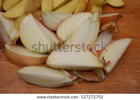 Raw white onions with raw potato fries