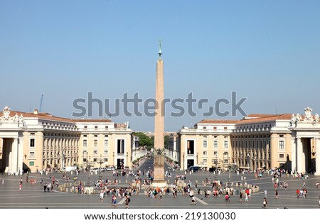 VATICAN CITY, VATICAN - JULY 19, 2014: People at Saint Peter's Square. St. Peter's Square is a massive plaza located directly in front of St. Peter's Basilica in the Vatican City