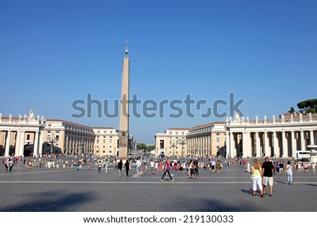 VATICAN CITY, VATICAN - JULY 19, 2014: People at Saint Peter\'s Square. St. Peter\'s Square is a massive plaza located directly in front of St. Peter\'s Basilica in the Vatican City