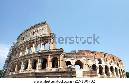 ROME - JULY 19: Coliseum exterior on July 19, 2014 in Rome, Italy. The Coliseum is one of Rome\'s most popular tourist attractions with over 5 million visitors per year.
