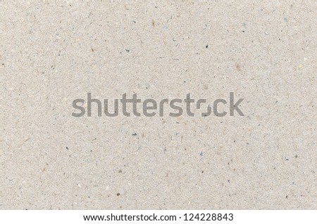Wrapping paper cardboard texture, light rough textured copy space background, grey, gray, brown, tan, yellow, beige