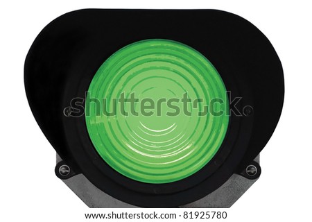 Green light railway traffic dwarf signal set at safe to go ahead, isolated railroad ground mounting lamp