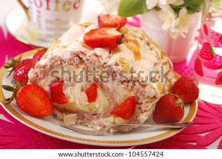 delicious cake-meringue swiss roll with whipped cream,fresh strawberry and almonds