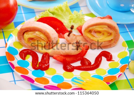 funny breakfast for child with snails made from frankfurter sausage and cheese