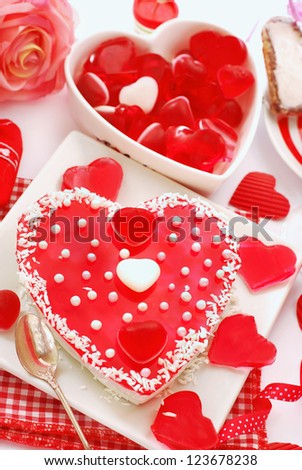 jelly cake in heart shape with white pearls topping for valentine`s party