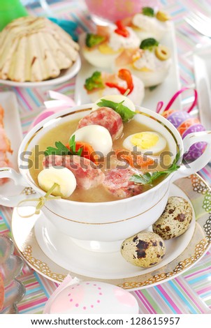 easter white borsht (zurek) in cup with quail eggs and white sausage bamboo stick