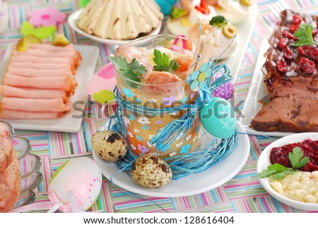 easter white borscht (zurek) in cup with quail eggs and white sausage bamboo stick and other traditional dishes