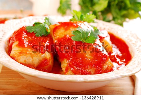 Stuffed cabbage leaves rolled with minced meat and rice in tomato sauce as traditional polish dinner