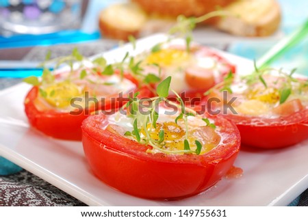 baked tomato halves stuffed with quail eggs and sausage