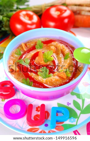bowl of  vegetable and tomato dense soup for baby
