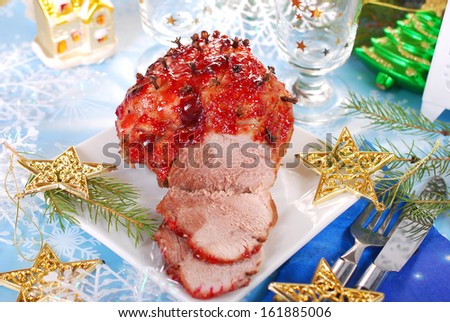 honey and plum glazed ham roasted with cloves for christmas dinner