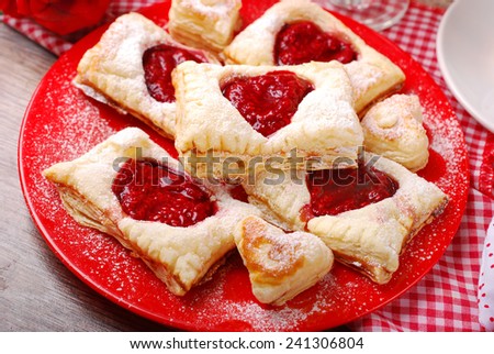 puff pastry cookies with raspberry confiture in heart shape for valentine party