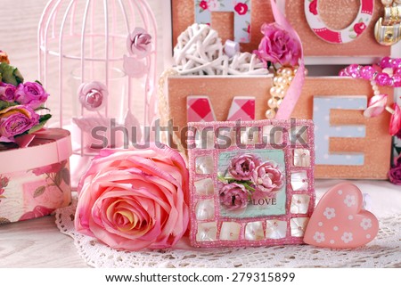 vintage home still life with beautiful photo frame,rose and wooden drawers box in romantic style