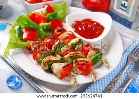 chicken,cherry tomato ,red and grill pepper grilled skewers on plate with ketchup for summer lunch