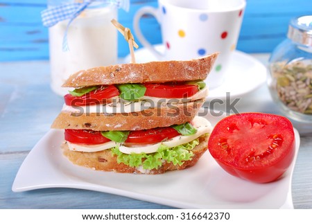 diet breakfast with caprese layered sandwich with oat flakes yogurt and tea