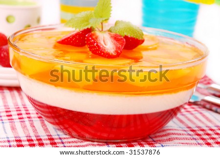 dessert with cream, strawberry and mango jelly in round bowl
