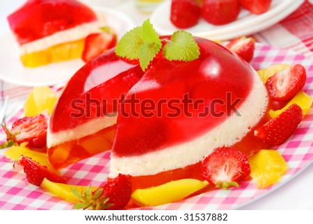 ball shape dessert with cream, strawberry and mango jelly