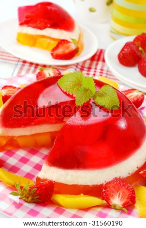 ball shape dessert with cream, strawberry and mango jelly