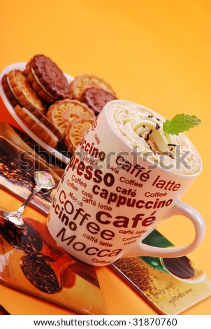 cappuccino coffee with cream and cookies