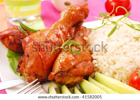 baked chicken legs with rice and vegetables