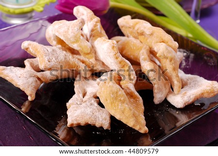 deep-fried pastries with icing sugar and donuts for carnival party