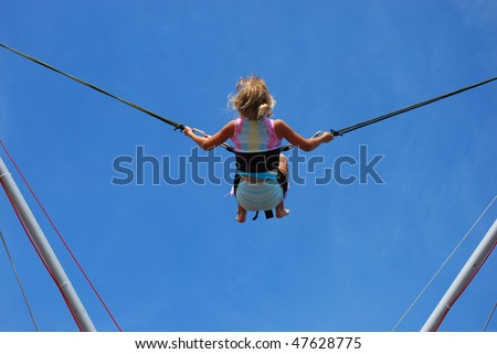 young girl having fun  on rope jumping