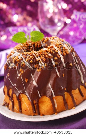 chocolate ring cake with nut topping for party