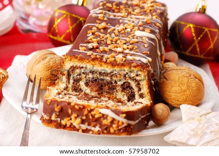 traditional poppy cake poured chocolate with nuts topping for christmas