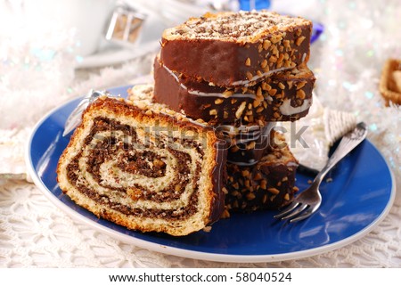 traditional poppy cake poured chocolate with nuts topping  for christmas eve
