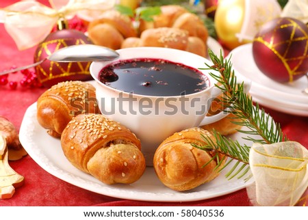 traditional red borscht and yeast pastries with mushrooms filling for christmas eve