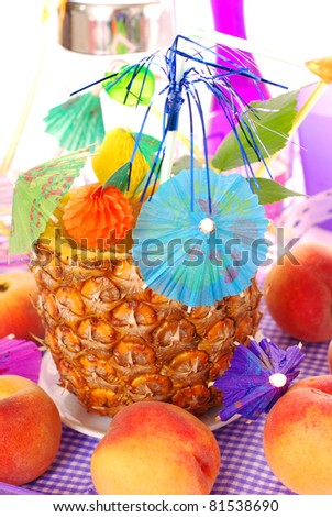 fresh pineapple  filled with tropical fruit`s drink with party decoration