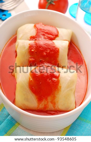 stuffed cabbage leaves rolled with minced meat and rice in tomato sauce as traditional polish dinner
