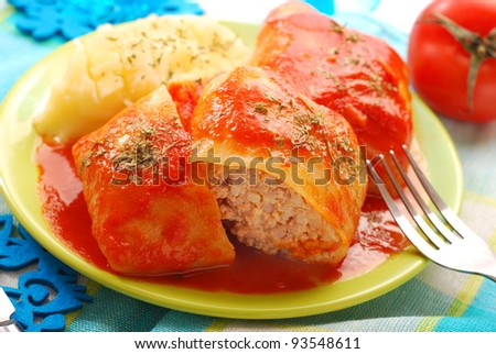 stuffed cabbage leaves rolled with minced meat and rice in tomato sauce as traditional polish dinner