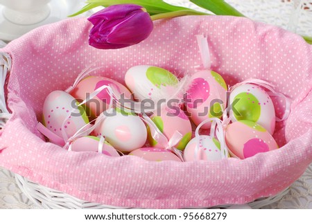 pink basket with easter eggs decoration