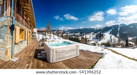 Beautiful luxury chalet in French Alps in the winter with Jacuzzi.