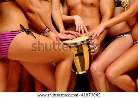 stock photo Young beautiful sexy girls playing drum with one boy