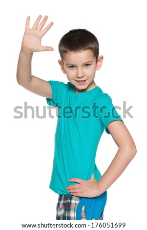A portrait of a young boy making greeting gesture