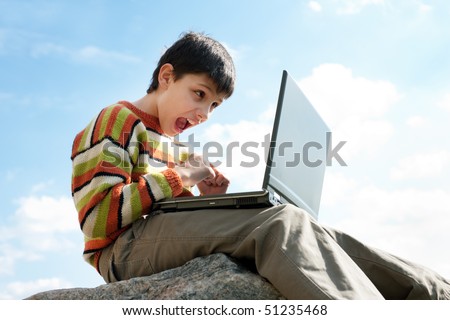 A boy is angry with the results of the computer game